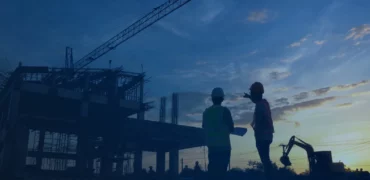Two people looking at a construction site
