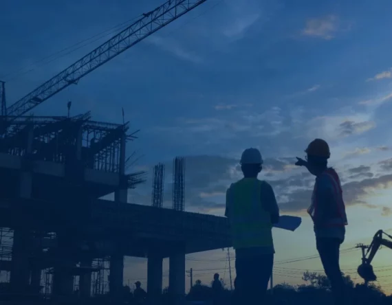 Two people looking at a construction site
