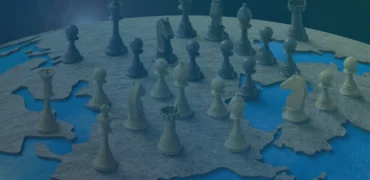 Chess pieces on a globe
