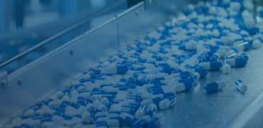 Pills on a metal shelf during manufacturing