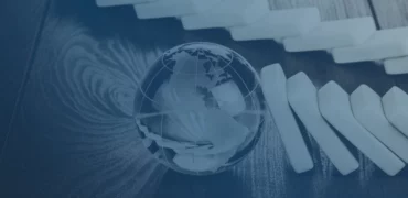 Glass globe paperweight on a desk